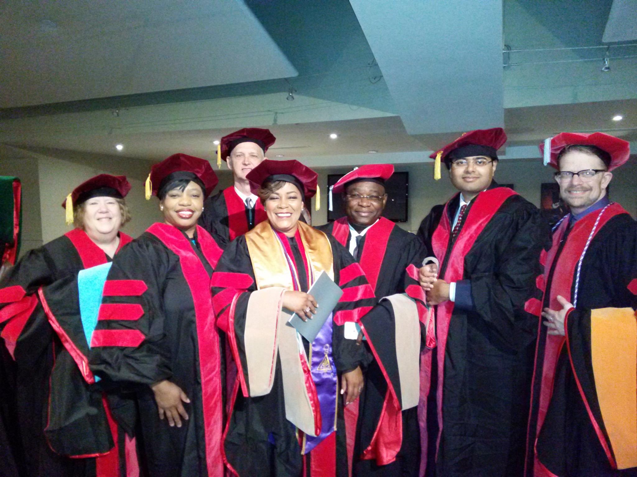 Dr. Crystal Davis wearing a graduation gown