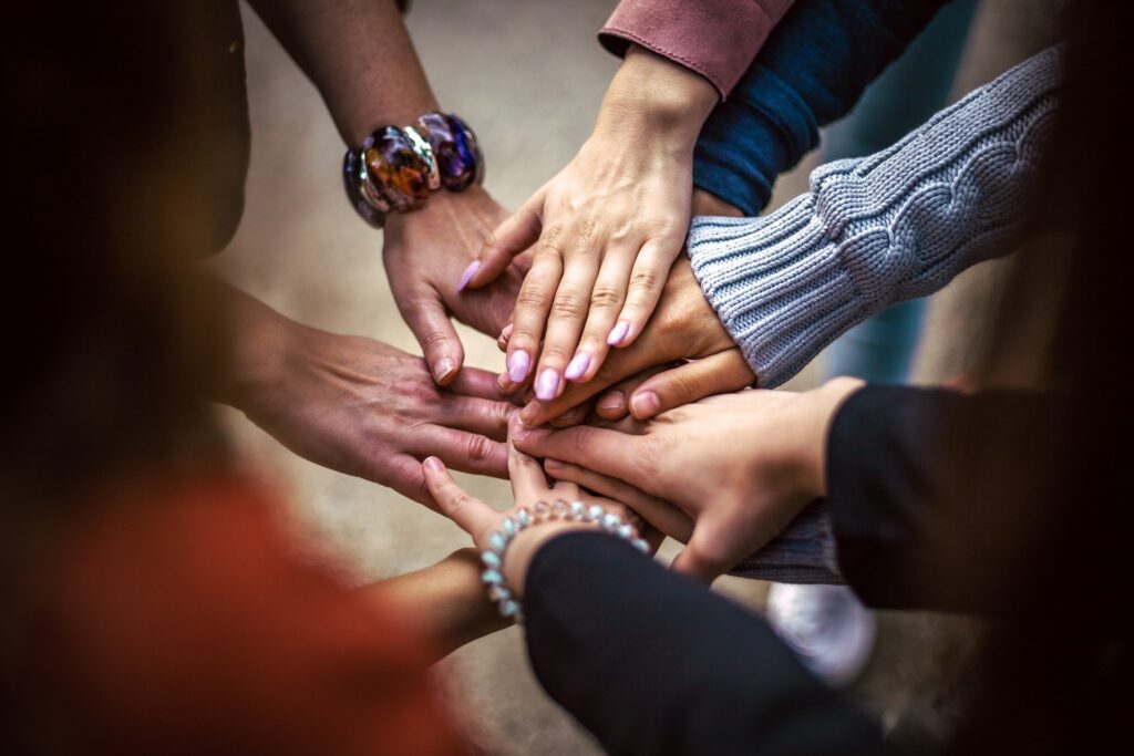 Group of People Joining Hands